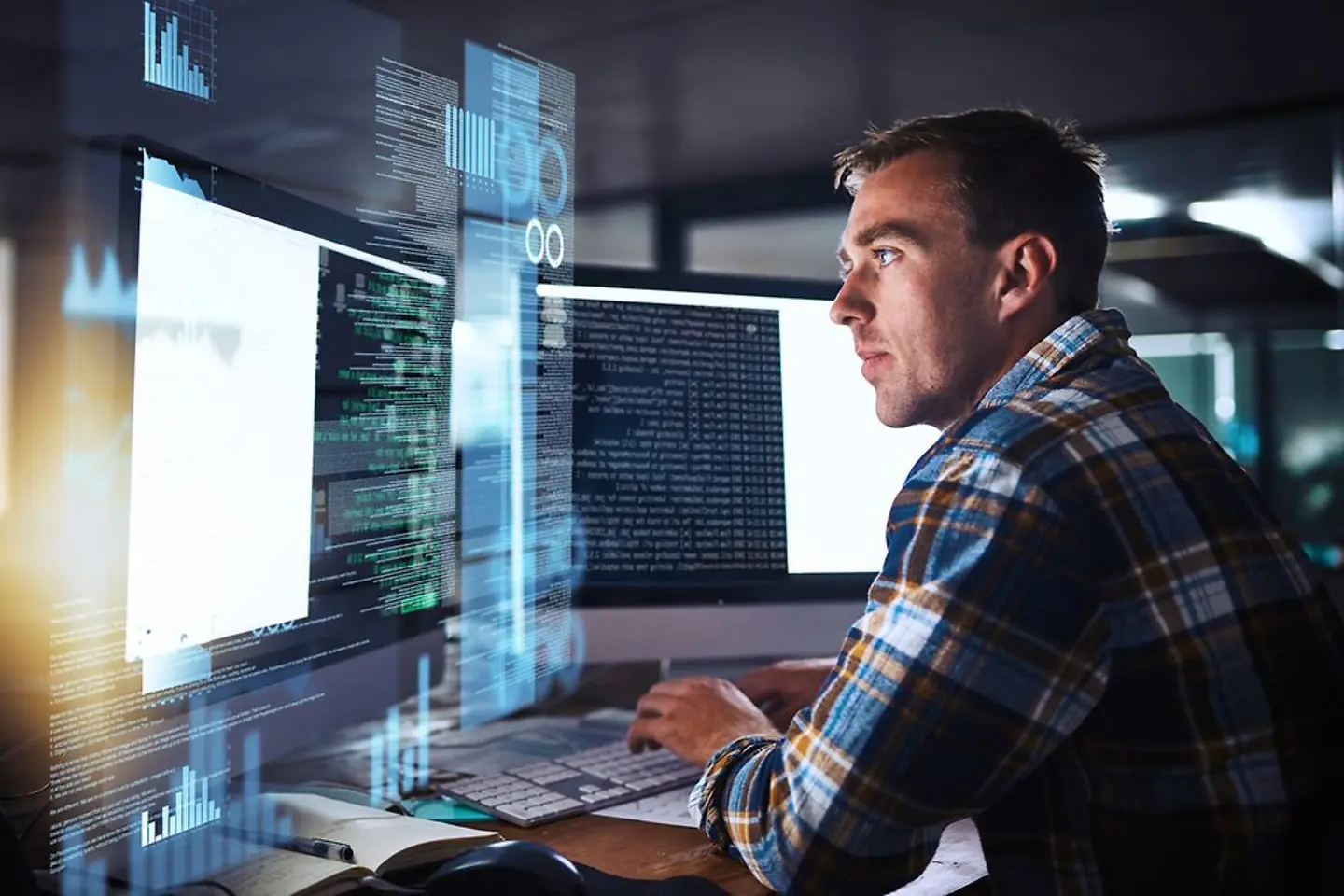 programmer in front of desktop immersed in AI technology