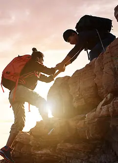 Asia couple hiking help each other on mountains 