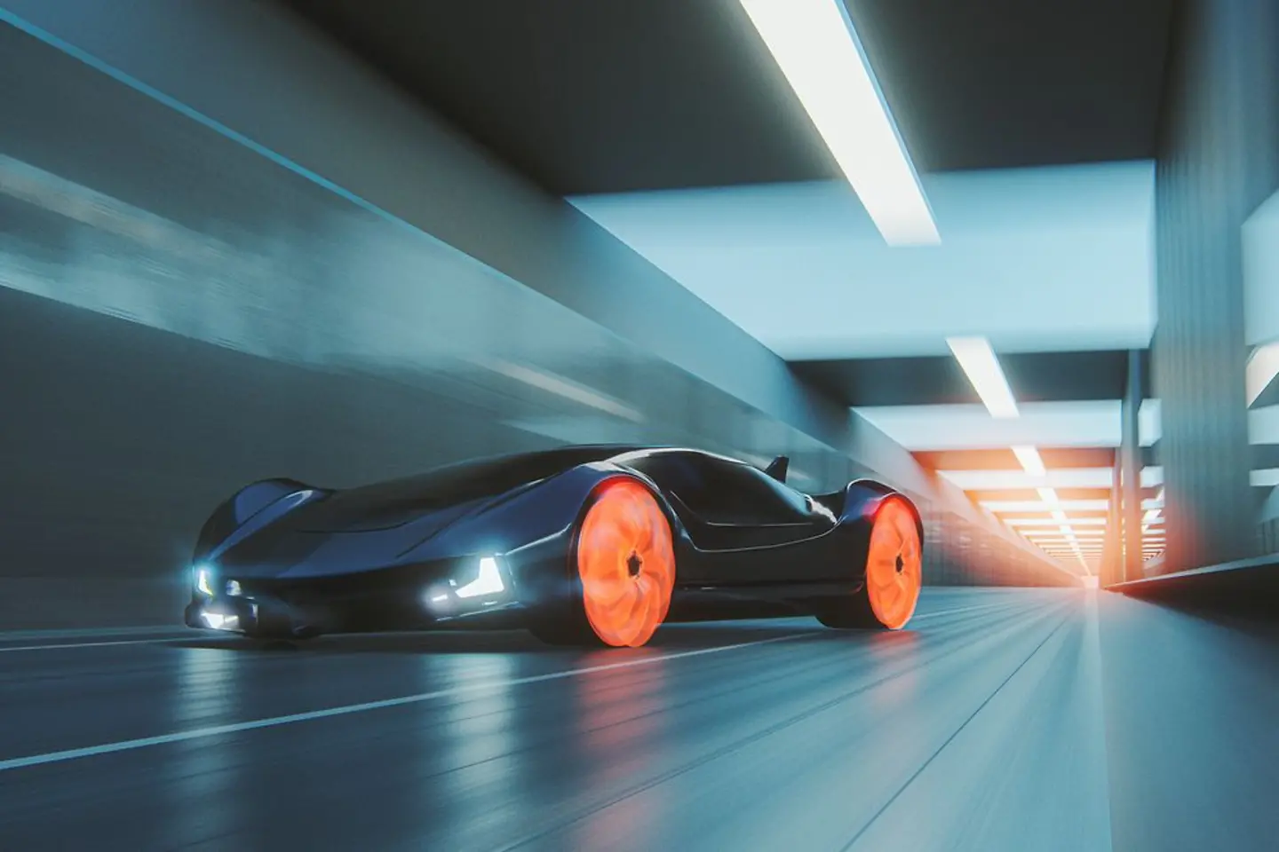 Futuristic car with orange glowing wheels drives through a tunnel