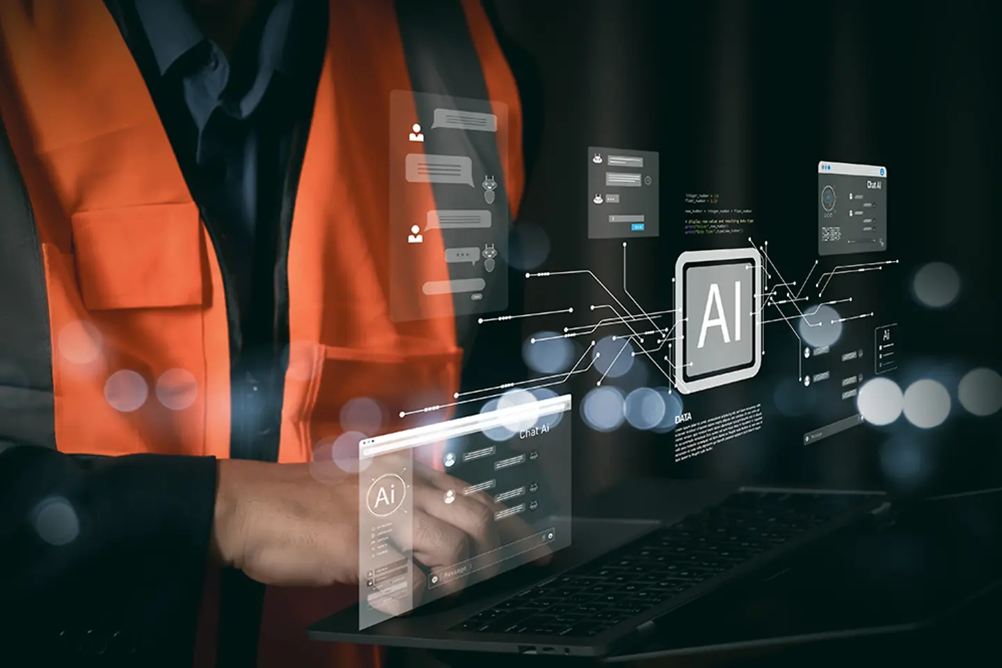 Industrial engineer using laptop with futuristic AI hologram interface. 